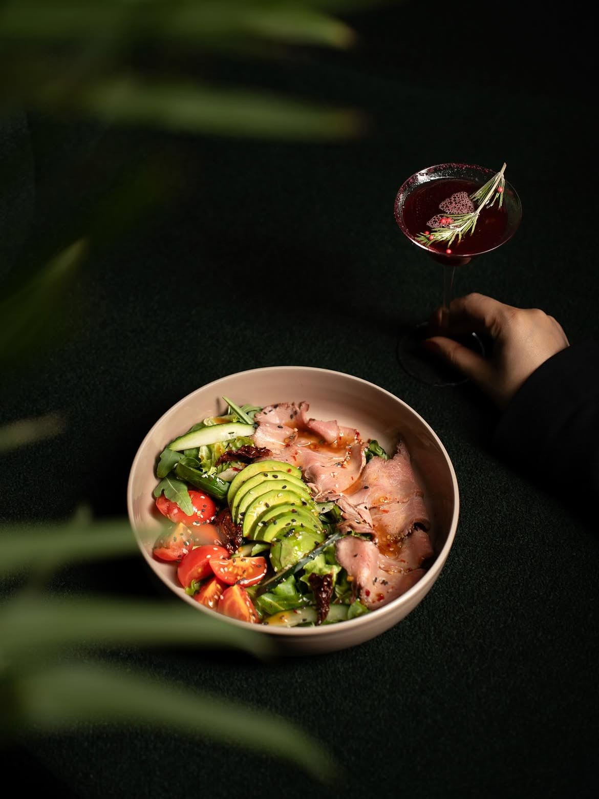 Salad course, cocktail in hand